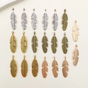 Detailed texture of leaf wing alloy pendants in silver, gold, bronze and rose gold