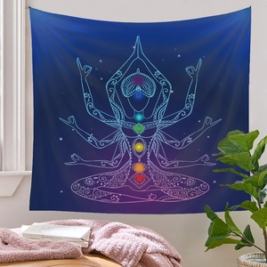 Detail of yoga chakra tapestry with glowing colorful points on a quiet bedroom wall