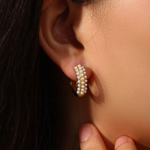 Elegant gold plated stainless steel hoop earrings with triple rows of white pearls