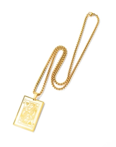 Detailed close-up of golden King of Hearts poker pendant and round box chain necklace