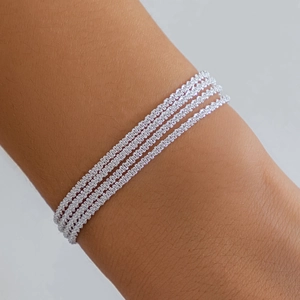 Close-up of four-layered silver braided chains showing detailed metallic texture and shine