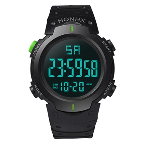 Close-up of digital sports watch with green LED backlight display and date function