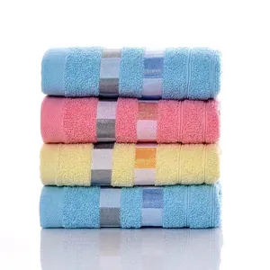 Soft cotton towel set in blue, pink, and yellow with decorative lattice weave texture