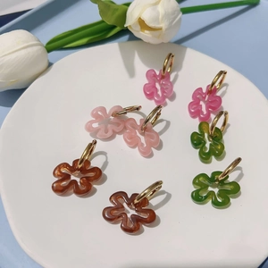 Colorful hollow flower drop earrings with golden hoops in various retro floral styles