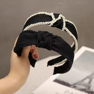 French vintage knotted headband with elegant bead trim and textured black fabric