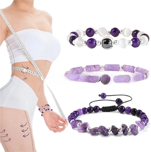Detail view of purple agate stretch bracelets featuring faceted crystals and beaded designs