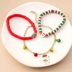 Detailed view of Christmas themed bracelet set with clay beads and festive charms