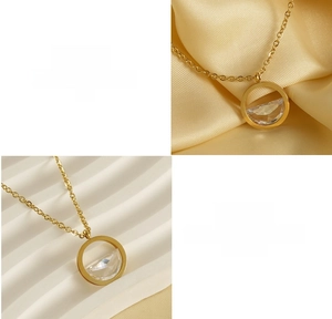Detail of 18K gold titanium steel necklace with zircon heart pendant and lobster clasp