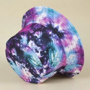 Detailed close-up showing the vibrant purple and blue abstract tie-dye texture on the bucket hat