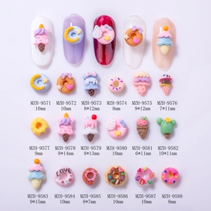 Variety of resin nail art charms featuring colorful ice cream and donut shapes in a grid
