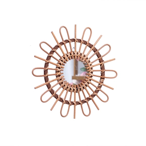 Handmade rattan sunflower wall mirror with natural wood accents for bohemian home decor