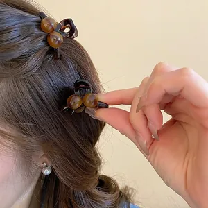 Elegant amber acrylic mini hair clips set with round bead design for women