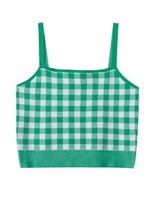 Detailed view of the green and white checkered knit fabric texture on a camisole top