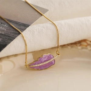 Gold box chain necklace with purple enamel leaf pendant and cubic zirconia accents