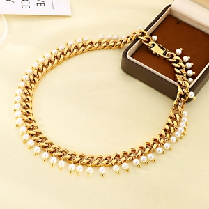 Golden 9mm Cuban link necklace with white pearl pendants and vintage hip hop style