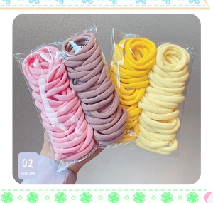 Close-up of seamless high elasticity hair ties in assorted Morandi colors and packaging