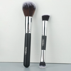 Detail of professional makeup brushes with matte black handles and soft gradient bristles