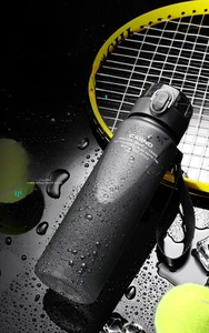 Macro shot of black frosted sport water bottle with PC material and carrying strap