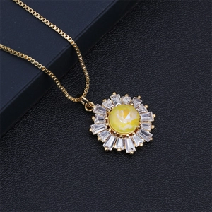 Macro shot of sun flower necklace with yellow gemstone and cubic zirconia on leather