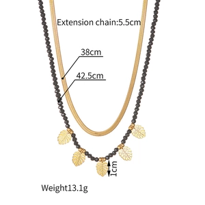 Double-layer necklace details showing gold leaf charms and black beads with measurements