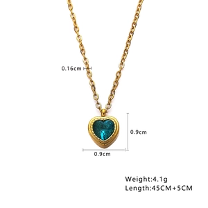 Elegant gold heart pendant necklace with blue gemstone inlay and adjustable chain links