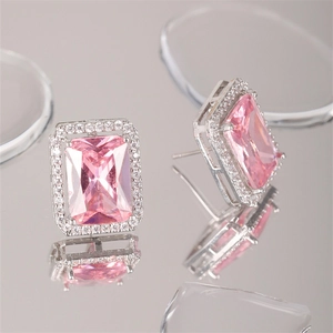 Elegant square pink zircon stud earrings with silver setting shown from a top-down view