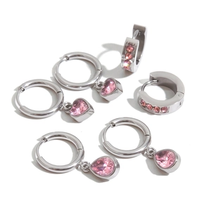 Detail of six pairs of silver stainless steel earrings with pink heart and teardrop stones