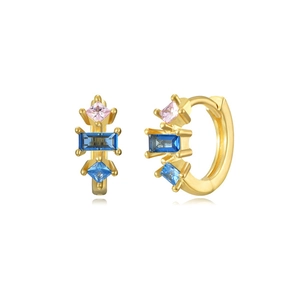 Detail of gold hoop earrings featuring multi-colored geometric zircon stones on white backdrop