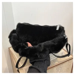 Minimalist black faux fur tote bag with silver zipper and leather strap for autumn