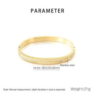 Detailed view of 18K gold plated stainless steel bracelet with paved zircon crystal stones