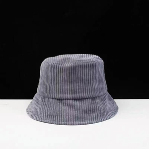 Detailed texture of gray corduroy fabric on a minimalist adjustable bucket hat