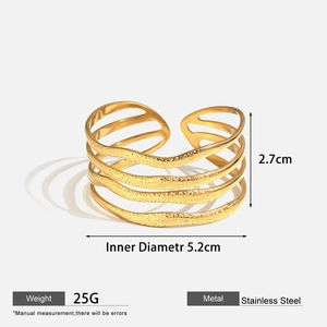 Detail view of gold stainless steel cuff showing 2.7cm height and 5.2cm inner diameter