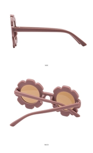 Detail view of flower-shaped kids sunglasses in dusty rose with matte plastic texture