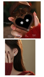 Detail view of S925 sterling silver snowflake stud earrings in a wooden jewelry gift box