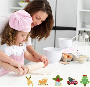 Family baking scene showing 5 assorted Christmas themed stainless steel cookie cutters