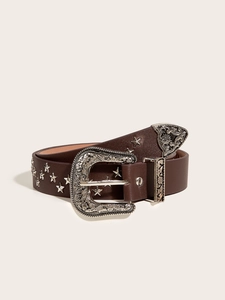 Detailed view of dark brown punk style belt with silver star studs and engraved buckle