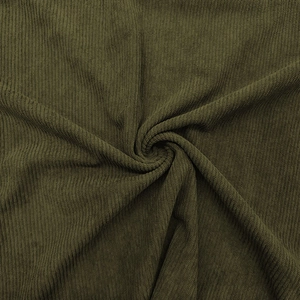 Detailed macro view showing the soft vertical ribbed texture of olive green polo shirt fabric