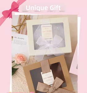 Detail of square gift boxes with transparent windows and elegant Best Wishes ribbons