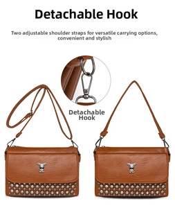 Detail of brown leather bag with metallic rabbit, rivets, and detachable dual straps