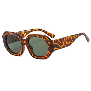Vintage tortoiseshell polygon sunglasses with dark green lenses in 45-degree angle view