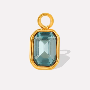Detail of 304 stainless steel gold pendant with emerald-cut blue crystal gemstone