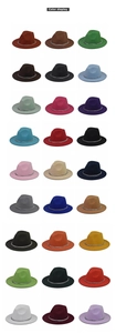 Close-up showing various colors of wool fedora hats with silver chunky metal chains