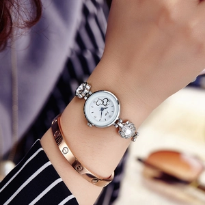 Elegant women's quartz watch with heart pattern dial and rhinestone flower link bracelet