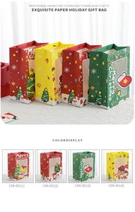 Detail of Christmas gift bags with transparent windows and festive patterns on textured paper