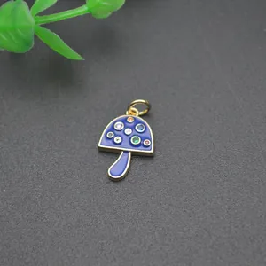 Cute mushroom charm with 18K gold plating and colorful zircons on blue enamel
