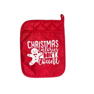 Red Christmas pot holder with gingerbread man print and holiday baking slogan