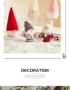 Detail of Christmas gnomes with knitted hats and faux fur beards on a snowy surface