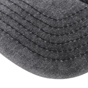 Macro shot of charcoal grey cotton baseball cap brim with six parallel reinforced stitches