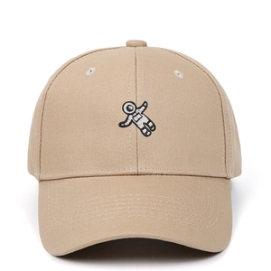 Close-up of high-quality astronaut embroidery on a khaki cotton baseball cap detail