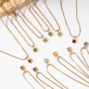 Golden stainless steel necklace with square multicolored zircon stone pendants on white